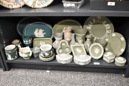 A large quantity of 20th-century Wedgwood Green Jasperware pottery, featuring neoclassical white