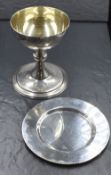 An Elizabeth II boxed silver communion set, comprising as chalice, paten and linen, of traditional