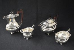 An Elizabeth II silver four piece tea set, comprising coffee, tea, sugar and cream, of oval form