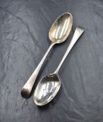 A pair of George III silver Old English pattern serving spoons, having an 'R' initial to
