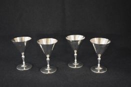 A set of four Elizabeth II silver sherry glasses, of traditional form having knopped stems over