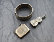 A George V silver vesta case, of hinged rectangular form having engine turned decoration with