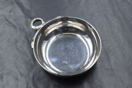 A 20th century silver taste de vin, of circular form having a snake motif handle, marks for