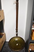 An early 20th-century turned wood, brass and copper bed warmer, 110cm, condition is consistent