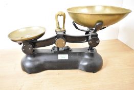 A vintage cast iron kitchen balance scale no weights included.