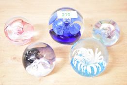 A Caithness 'Mooncrystal' pattern glass paperweight, h5cm, sold together with four similar