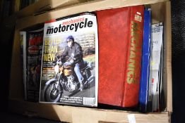 A collection of vintage Motorcycle Mechanics magazines in binders ranging from 1995-2001 and a