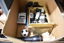 A Sharp ELSIMATE calculator, a pair of Bausch & Lomb Opt. Co. 6x30 binoculars, two hand torches, a