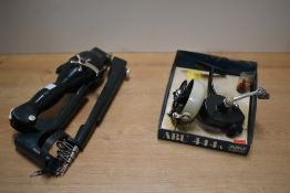 A vintage Abu 444A in the bottom half of its display box and an instant fisherman folding telescopic