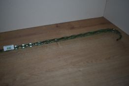A Nailsea style twisted glass walking stick measuring 106cm long