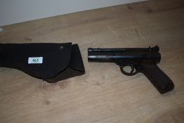 A Webley Premier air pistol in a leather holster missing barell release lever for spares or repair