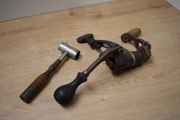 A vintage shotgun cartridge re-loader and a powder and shot measure