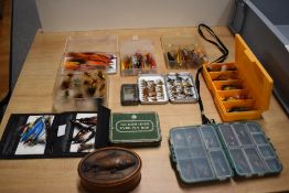 A selection of fishing flies in a variety of pocket sized boxes