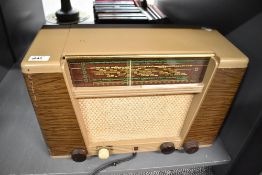 A mid 20th-century Phillips vacuum tube radio, with AC/DC setting with a bakelite case, 44cm