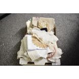 A quantity of 20th-century soft goods, to include hand made doilies, tablecloths, table runners