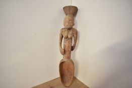 A 20th-century African Art presumed Congolese Mangbetu Carved Wood Figural Spoon, featuring a female