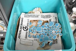 An assortment of decorative joycolor mosaic tiles.