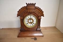 An early 20th-century The Ansonia Clock Company (1851-1929) walnut 'Tunis' mantle clock, featuring