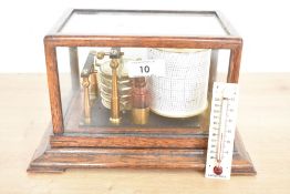 A late 19th to early 20th-century Negretti and Zambra (founded 1850) oak cased barograph,