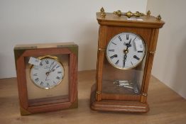 Two 20th-century wood and brass mantel clocks, to include an Urgos (2852) wood-cased pendulum