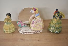 Three 20th-century porcelain figurines to include, a Royal Doulton-style porcelain figurine with a