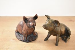 Two late 20th-century spelter and resin decorative pig sculptures, unmarked, (2), condition is