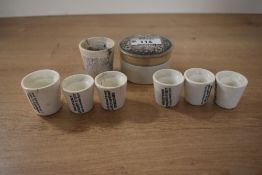 A Victorian iron stone advertising pot for 'cold cream', featuring a monochrome gothic-style