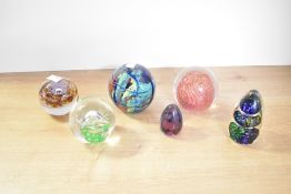 A quantity of 20th-century studio glass paperweights, to include a Wedgwood round purple and brown