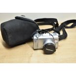 An Olympus C-765Ultra Zoom Digital Camera with lympus 1:2,8-3,7 63mm lens, in soft camera case