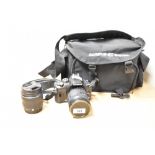 An Olympus E400 DSLR camera with Olympus Digital 40-150mm 1-4-5,6 lens, and Olympus 14-42mm 1:3,5-