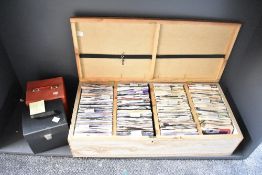 A large quantity of 20th-century 7-inch vinyl records, in a large purpose-built wooden box having
