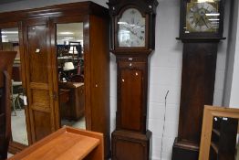 A 19th Century mahogany long cased clock having eight day movement with brass and silvered dial