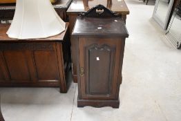 A Victorian stained mahogany pot cupboard, of traditional design with shaped, carved and pierced