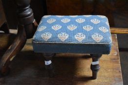 A small Victorian padded foot stool, of rectangular form, the pattered and slightly padded