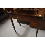 A 19th century oak fold over tea table, of rectangular form with reeded edge detail and tapering
