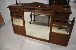 A late Victorian oak mirror back sideboard, of typical arrangement with three bevelled glass