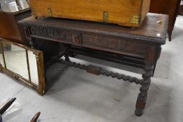 A Victorian oak side table, of rectangular form with gadrooned edge detail over foliate scroll and