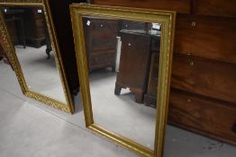 A modern rectangular gilt framed wall mirror 98cm x 66cm