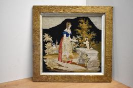 An antique Berlin woolwork tapestry depicting and outdoor scene with a girl and little dog, dark