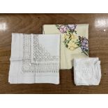 Three antique and vintage tablecloths, to include white cotton lace crochet, cut out and embroidered