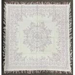 An rare handmade antique Welsh quilt or tablecloth, having blue and white threads woven into a