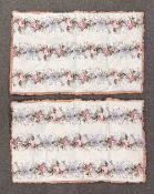 Two 1950s Eiderdown blankets in matching floral, pastel pink and purple on a white ground with