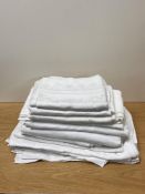 A large quantity of antique and vintage white and ivory cotton damask, assorted pattern designs