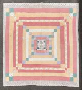 A Victorian North-country patchwork quilt in a combination of ditsy floral patterned cotton fabrics,