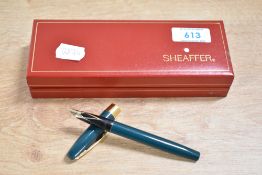 A boxed Sheaffer Legacy cartridge fill fountain pen in Green with a broad cap band having 23K Gold