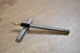 A ST Dupont Classique cartridge fill fountain pen with a hooped ridge finish having 18ct Dupont