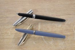 Two fountain pens. A Wilson (made in Italy) plunger fill fountain pen in Grey and a Queensway