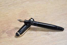 A Montblanc 3-42.G piston fill fountain pen in Black with single cap band having Montblanc 14CT