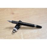 A Montblanc Starwalker cartridge fill fountain pen in Black with platinum trim having having