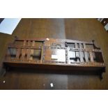 Local interest* Ernest John Oldcorn, an Arts & Crafts oak wall rack, the shaped back over the